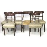 A set of five wooden framed upholstered dining chairs and a matching carver.
