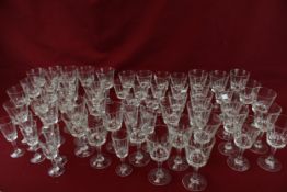 A large collection of assorted wine drinking glasses.