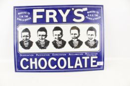 A reproduction enamel 'Frys Chocolate' sign.