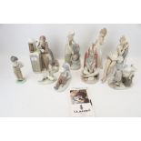 A collection of nine assorted Lladro and Nao porcelain figures.