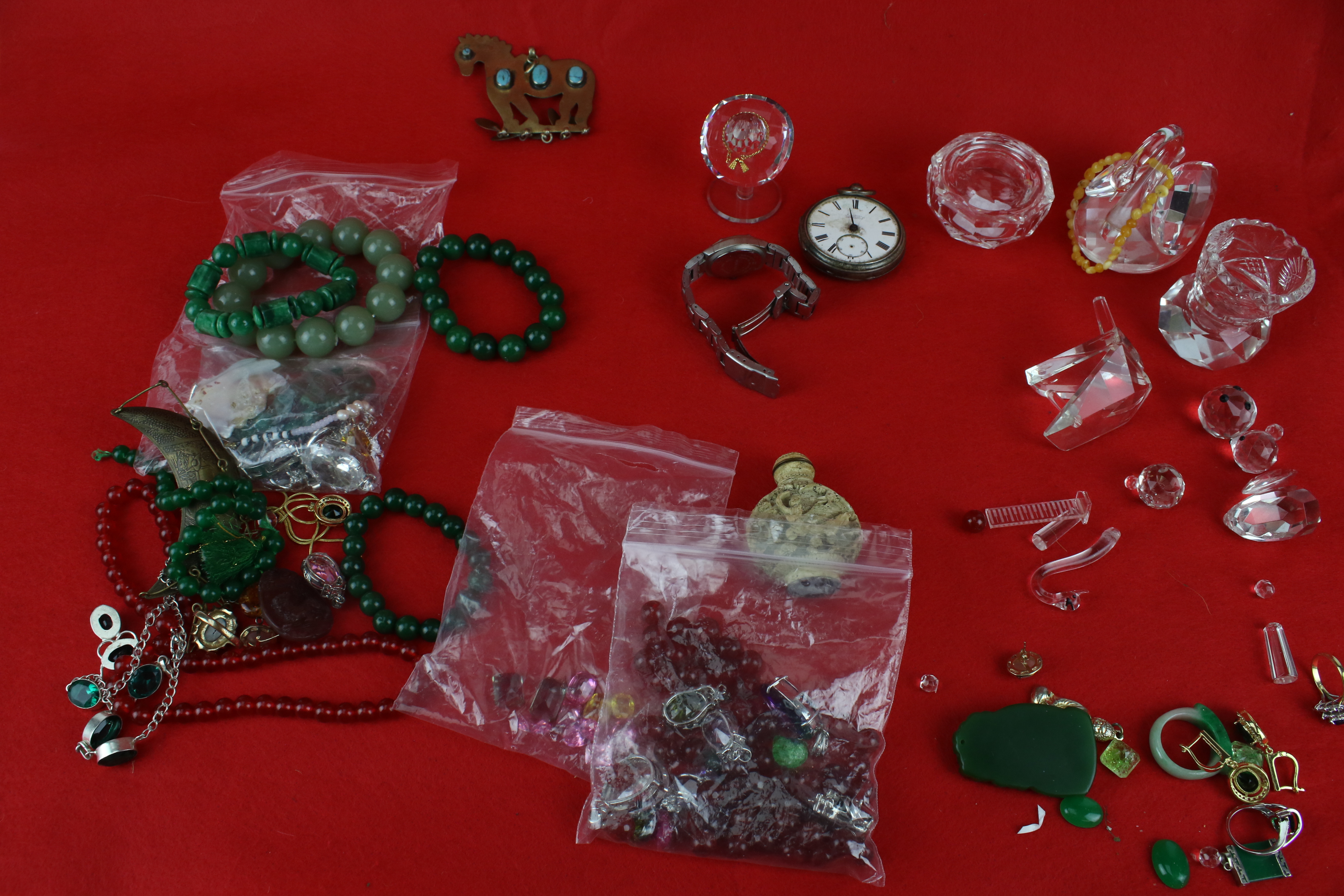 A collection of assorted costume jewellery and crystal glass animals.