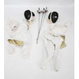 Vintage fencing sport equipment. Including three foils, two 'Paul' face mask helmet, etc.