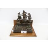 A bronze inkwell in the form of HMS Victory.
