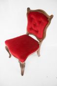 A Victorian mahogany framed upholstered chair.