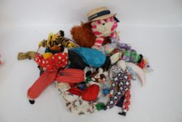 A mixed lot to include two straw boaters, a quantity of hand puppets, textiles, soft toys, etc.