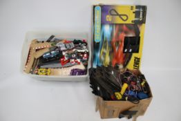 A large group of assorted vintage slot car race collectables.