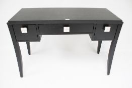 A contemporary black ash writing desk.