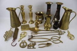 A group of assorted vintage brass household items.