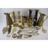 A group of assorted vintage brass household items.