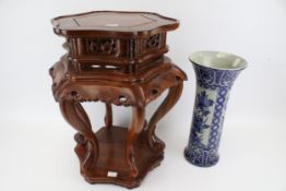 A Chinese hardwood stand together with a blue and white vase Condition Report: Stand