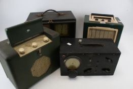 Four assorted vintage radios.