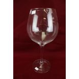 A very large handmade wine glass.