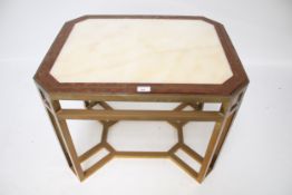 A contemporary brass framed marble top side table.