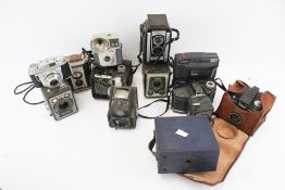 A collection of assorted vintage film cameras. Including Kodak Brownie Reflex, an Ilford Envoy, etc.
