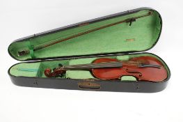 A vintage cased violin and bow. Labelled 'The Maidstone' school orchestra, London.