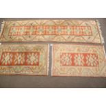 A pair of wool rugs and a similar runner. 2x 127cm x 82cm & 275cm x 80cm (3).