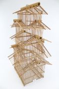 A vintage three tier bamboo pagoda bird cage.