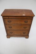 A 20th century Georgian style butler's chest of drawers.