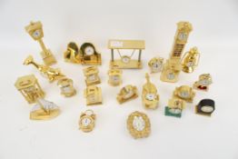 A collection of 22 brass cased miniature novelty clocks/timepieces.