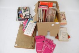 A collection of Ordnance Survey maps and a box of labels.