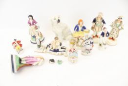 A collection of Staffordshire figures.