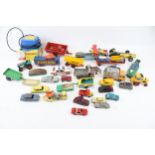 A collection of assorted playworn diecast vehicles.