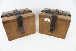 A pair of wall mounted oak church collection boxes. With wrought iron clasp, L20cm x D15cm x H15.