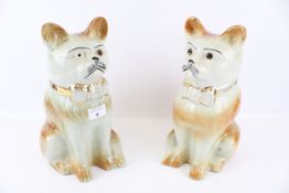 A Pair of Scottish (Bo'ness?) Staffordshire style seated ceramic cats with glass eyes. H31.