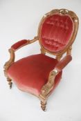 A vintage wood frame open armchair.