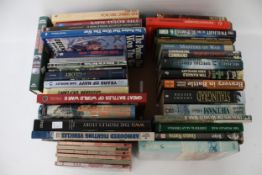 A large collection of militaria related books. Including DVD box sets, etc.
