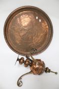 A brass and copper three branch ceiling lamp hook and a circular copper tray.