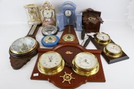 A collection of 20th century and later clocks and barometers.