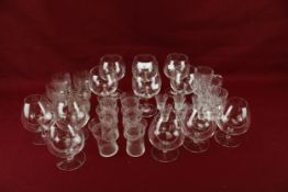 A collection of assorted 20th century drinking glasses.