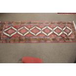 A kilim style wool runner carpet.