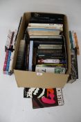 A collection of assorted books. Film, cinema and pop music related plus 'Friends' dvd box sets.