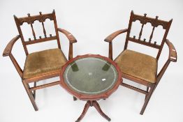 A pair of early Ercol open armchairs.