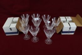 Set of ten Waterford crystal wine glasses and two boxed sets of six. Max. H13.