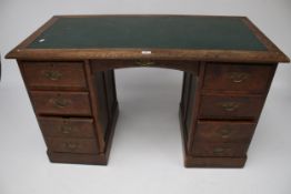 An early 20th century oak twin pedestal desk.