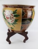 A large contemporary Chinese pot on stand.