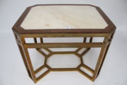 A contemporary brass framed marble top side table.