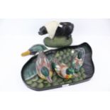 A hand painted papier mache mallard duck tray with three ducks and cast a metal pig door stop