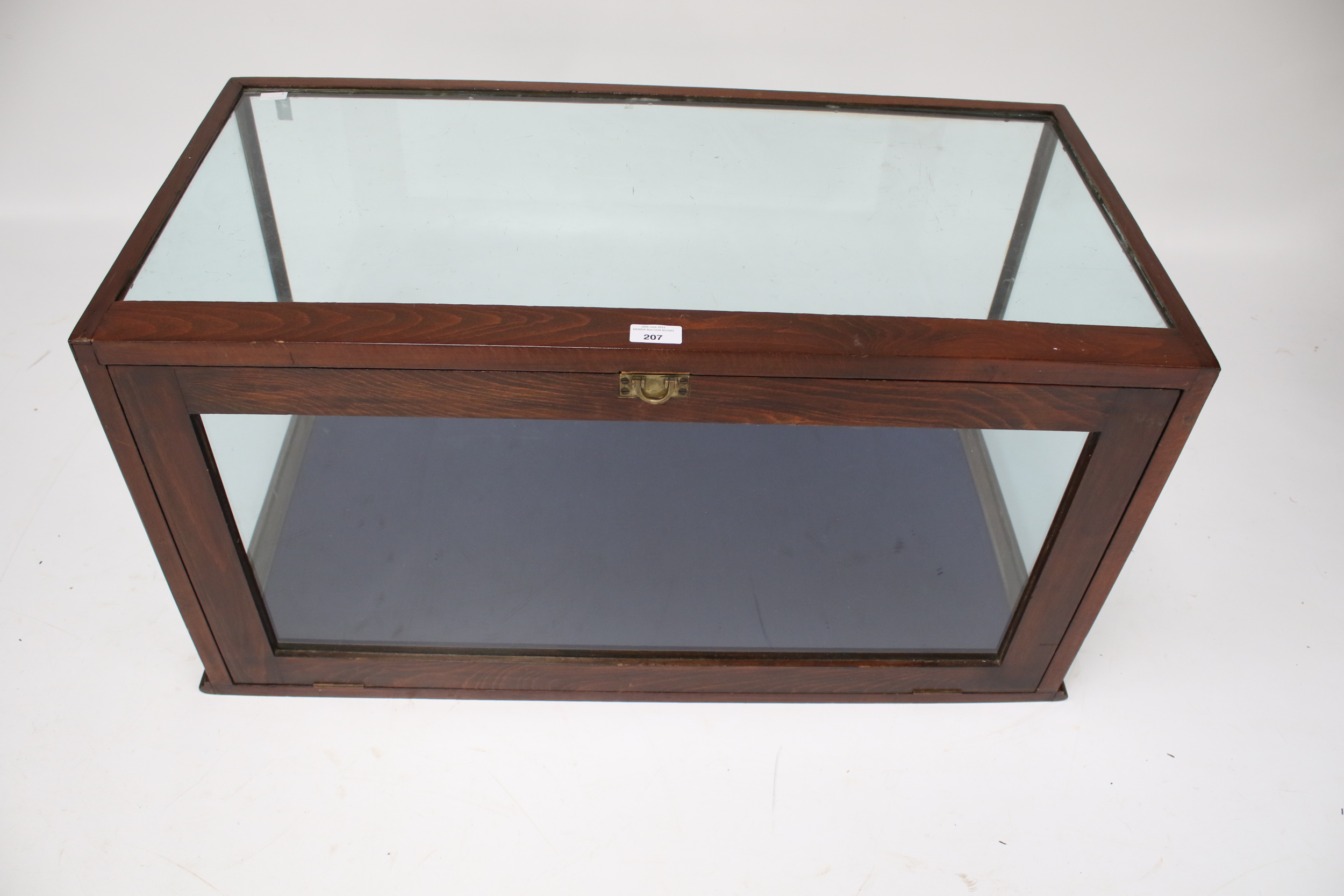A Victorian mahogany glazed display cabinet. The hinged door opening via a latch, H46cm x W90.