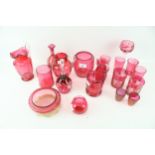 A collection of twenty assorted Cranberry glass items.