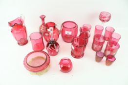 A collection of twenty assorted Cranberry glass items.