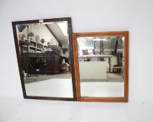 Two framed wall mirrors.