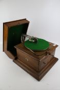 A vintage HMV table top wind-up gramophone.