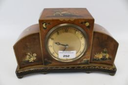 A 20th century chinoiserie style mantel clock.