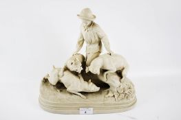 A 19th century Copeland parian ware ceramic statue of a 'boy and dogs' (AF).