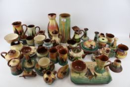 A large collection of assorted 20th century Torquayware. Including jugs, candlesticks, etc. Max.