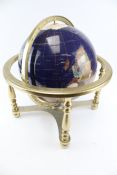 A Lapis Globe mounted with mineral and semi-precious stones.